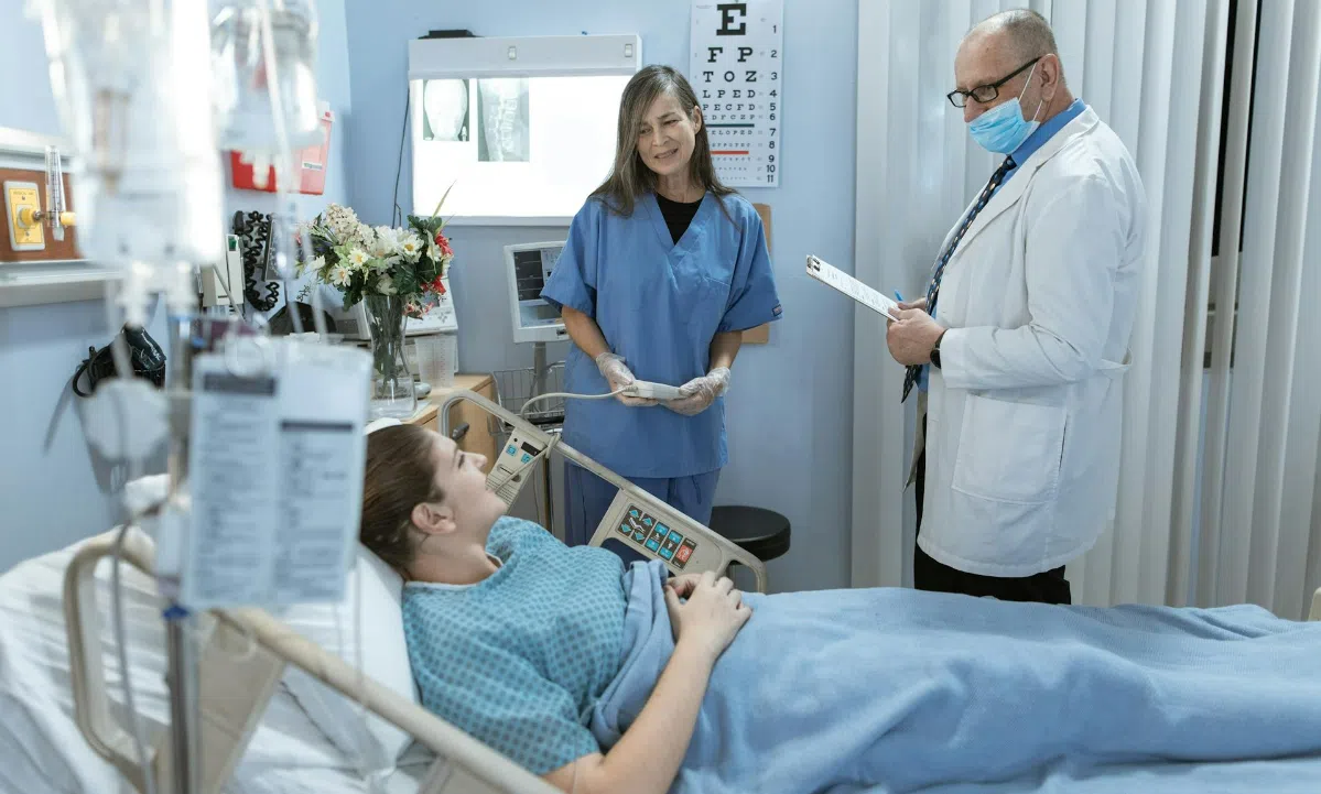 Patient on hospital bed recovering after an injury.